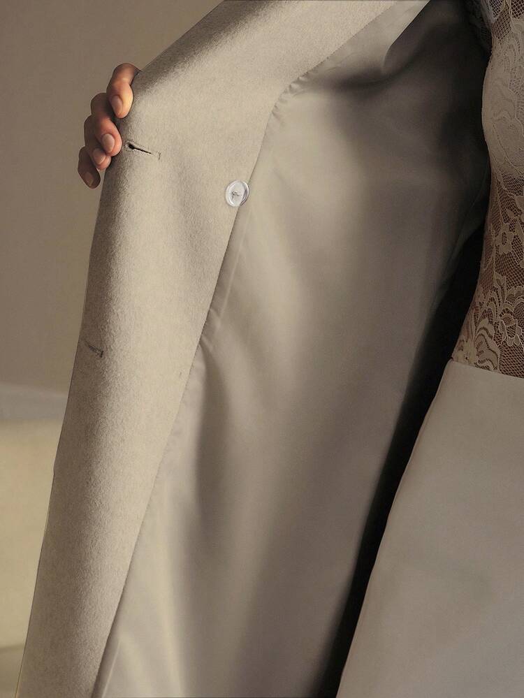 DOUBLE BREASTED BELTED OVERCOAT