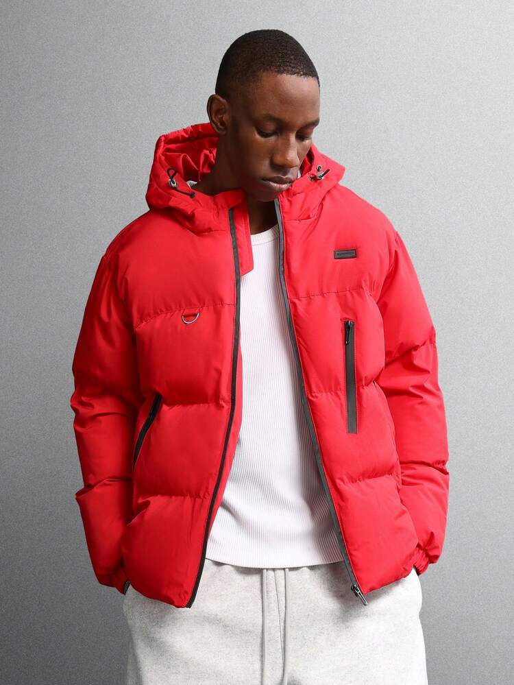 Pikowana kurtka puchowa z kapturem i kieszeniami zapinanymi na zamek