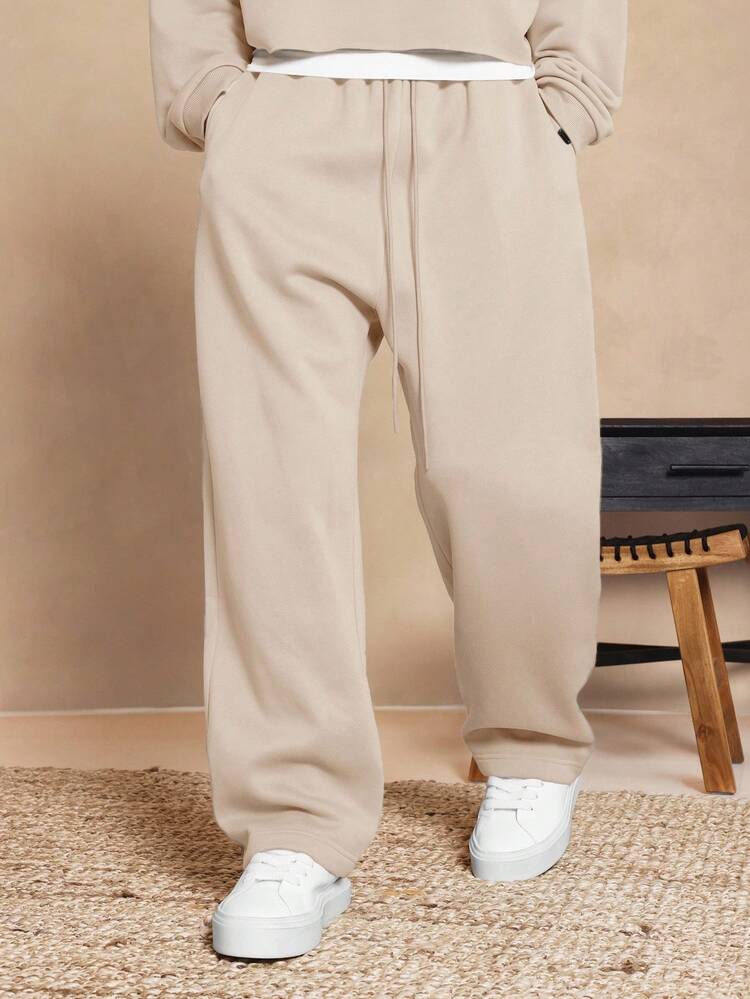 Drop Crotch Sweatpants With Elastic Ankles And Side Pockets
