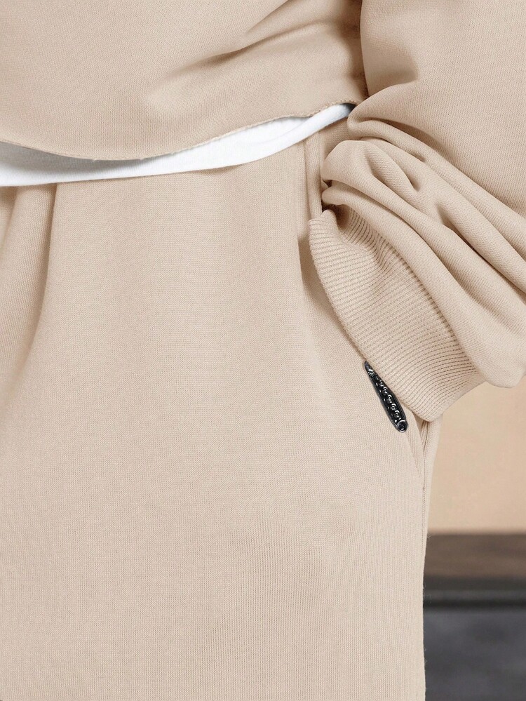 Drop Crotch Sweatpants With Elastic Ankles And Side Pockets