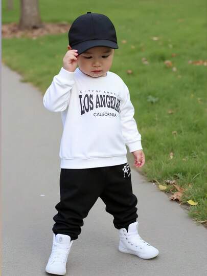 SHEIN 2pcs/Set Toddler Boys/Girls Long Sleeve Sweatshirt And Casual Sports Pants Set, Dark Grey Crew Neck Sweatshirt With White Letter Print, Suitable For Daily Wear And Holidays Baby Boy Streetwear Outfit Black And White Baby Boy Outfit Los Angeles Baby Clothes Baby Boy Casual Outfit Baby Boy Clothes Neutral Baby Clothes Fall Winter