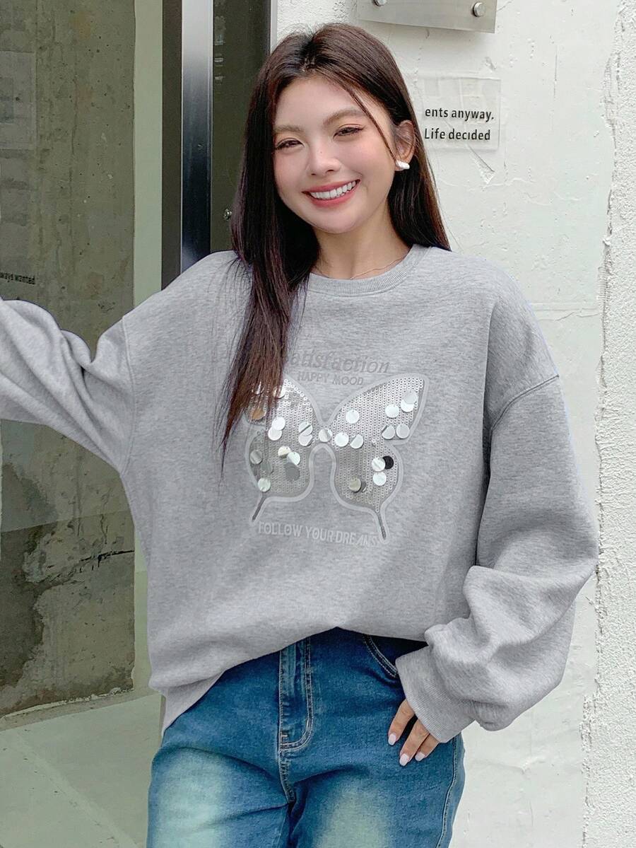 Dazy Plus Felpa oversize con fiocco e stampa a paillettes, con fodera termica, vestibilità morbida, collo a giro, maniche lunghe, colore grigio, taglia grande, adatta per l'autunno/inverno - Grigio - Visualizzare 1