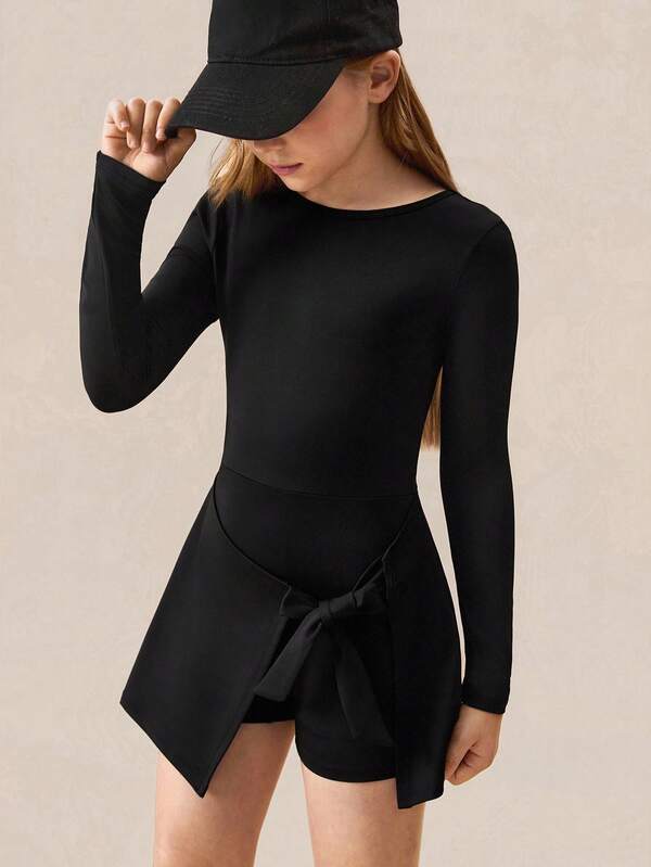 SHEIN Vestido casual negro para niñas preadolescentes, ropa deportiva de moda, diseño único de dobladillo, lazo desmontable