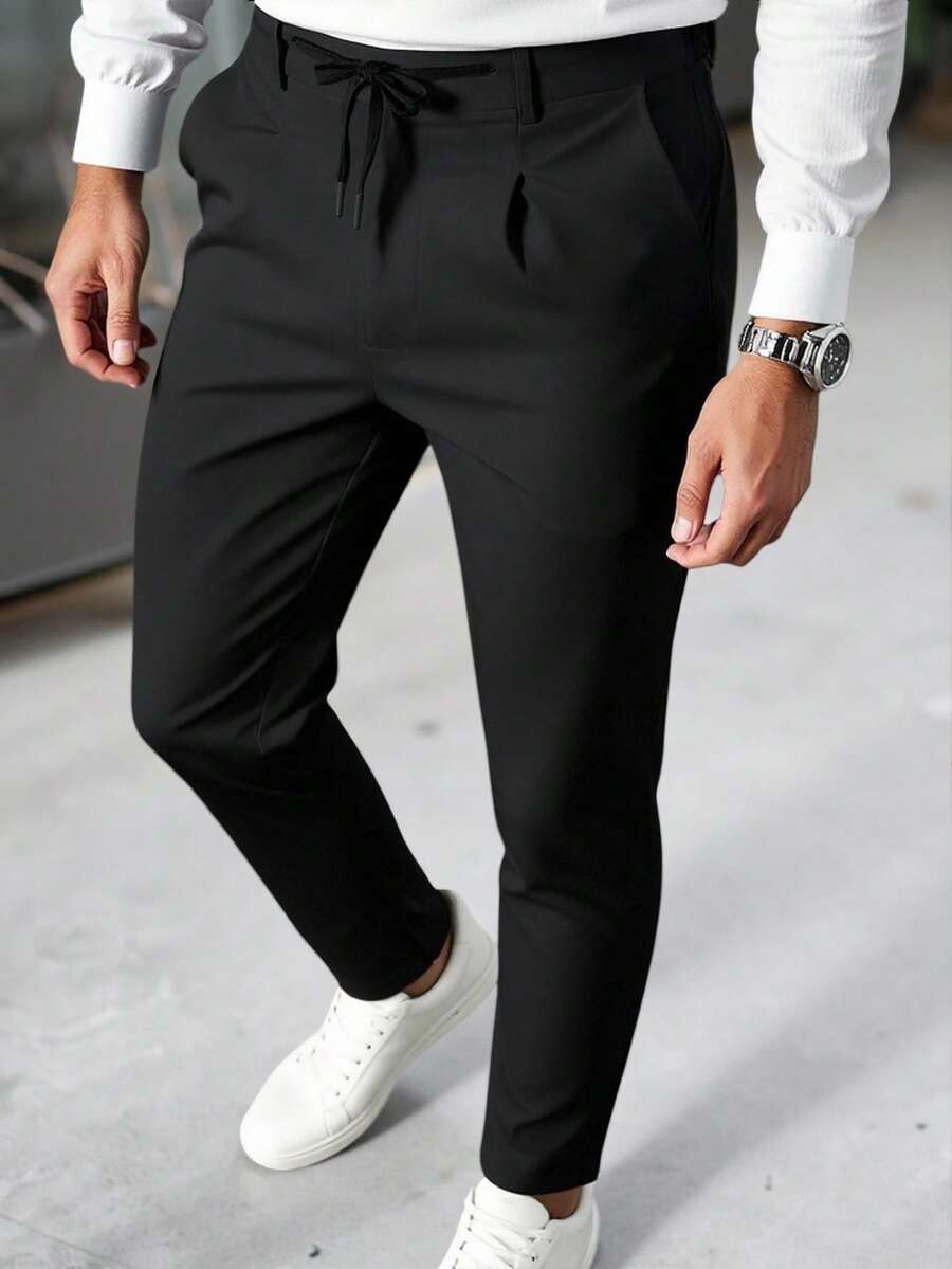Manfinity Mode Quần tây công sở nam phong cách thường ngày, INS kết hợp với quần tây tiết kiệm chi phí. Sản phẩm có thiết kế thắt lưng, phù hợp cho việc đi làm, dự tiệc và mặc hàng ngày. Sản phẩm cũng là một món quà lý tưởng cho bạn trai hoặc chồng. Quần tây công sở nam màu trơn, cạp rút dây, quần âu, phong cách cổ điển. - màu đen - Xem 1