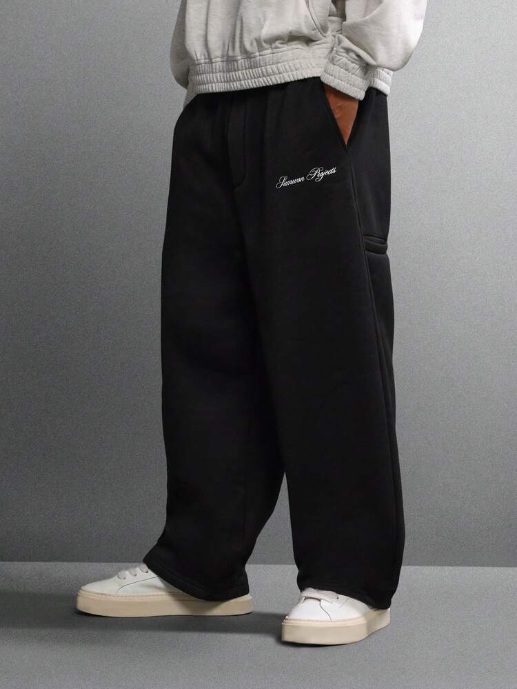 Calça de moletom de perna larga com logotipo bordado e bolsos laterais