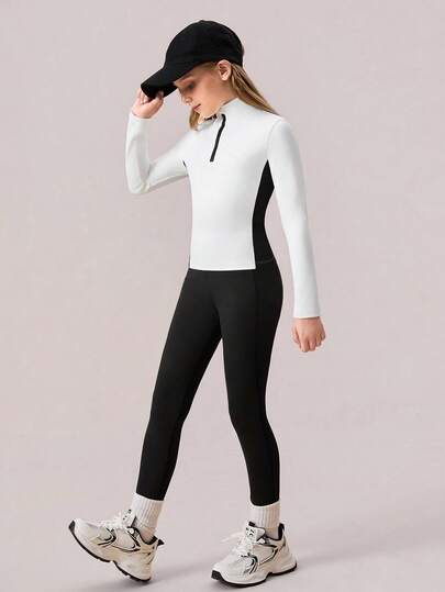 Conjunto de ropa deportiva en blanco y negro para niñas preadolescentes. Blusa de manga larga blanca + pantalones negros, tela elástica y cómoda, con bolsillos laterales en los pantalones para guardar artículos como el teléfono.