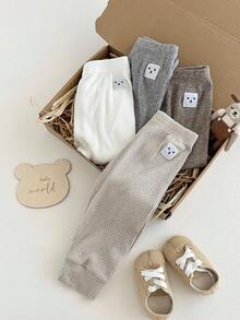 SHEIN 4 件套男婴/中性笑脸设计裤子，舒适可爱，适合户外玩耍或日常穿着，四季皆宜