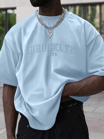 Manfinity Homme Camiseta de manga corta casual con estampado de letras en relieve para hombres de talla grande, verano