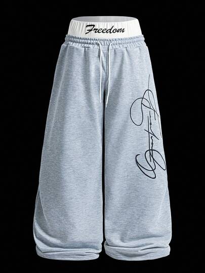 Manfinity EMRG Men's Street-Style Popular INS Matching "FREEDOM" Embroidered Fashionable Embroidery Outdoor Music Festival Nightclub Boyfriend/Husband Gift Anniversary Gift 2 In 1 Double Waistband Sweatpants , Grey Sweatpants , Baggy Sweatpants , Men Sweatpants , Graphic Sweatpants