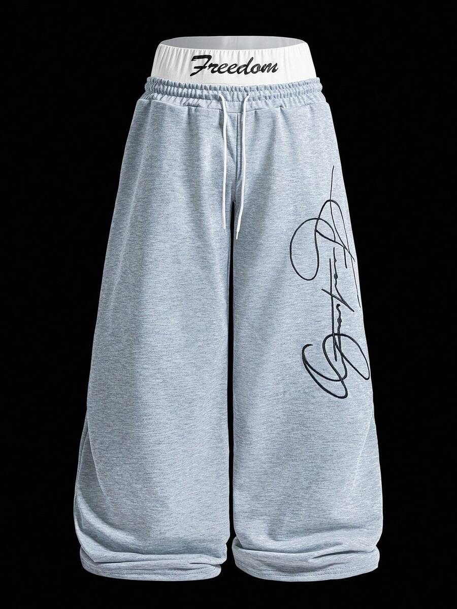 Manfinity EMRG Men's Street-Style Popular INS Matching "FREEDOM" Embroidered Fashionable Embroidery Outdoor Music Festival Nightclub Boyfriend/Husband Gift Anniversary Gift 2 In 1 Double Waistband Sweatpants , Grey Sweatpants , Baggy Sweatpants , Men Sweatpants , Graphic Sweatpants - Light Grey - View 1