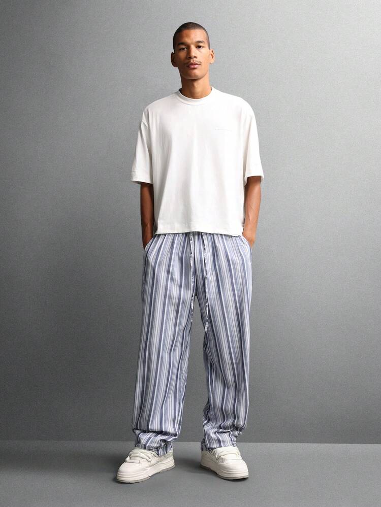 Calças casuais listradas de perna larga com cós elástico