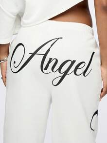 SUMWON Pantalones de chándal de talla grande con estampado de texto de ángel y gráficos de alas laterales para comodidad casual