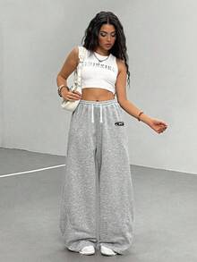 Sparklyn Spodnie dresowe dla nastolatek o luźnym kroju i zakrzywionych nogawkach, modne na co dzień, uniwersalne, sportowe, długie, odpowiednie do tańca, szkoły i sportu