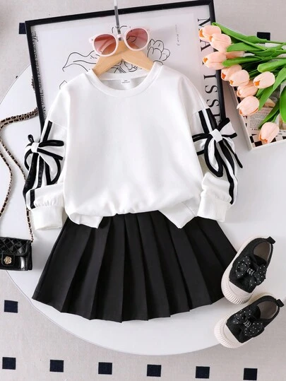 Bộ 2 món áo len dài tay cổ tròn và chân váy xếp ly tối giản họa tiết nơ 3D cho bé gái, màu đen, trang phục mùa thu thời trang, bộ 2 món áo và chân váy, đồ đi học cho bé gái, trang phục thiếu nữ, áo dài tay và chân váy, quần áo có nơ, trang phục học sinh thiếu niên, bộ 2 món, trang phục dài tay dễ thương cho bé gái, đồng phục đi học, bộ 2 món
