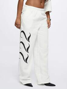 SUMWON Pantalones de chándal de talla grande con estampado de texto de ángel y gráficos de alas laterales para comodidad casual