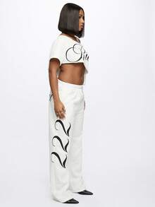 SUMWON Pantalones de chándal de talla grande con estampado de texto de ángel y gráficos de alas laterales para comodidad casual