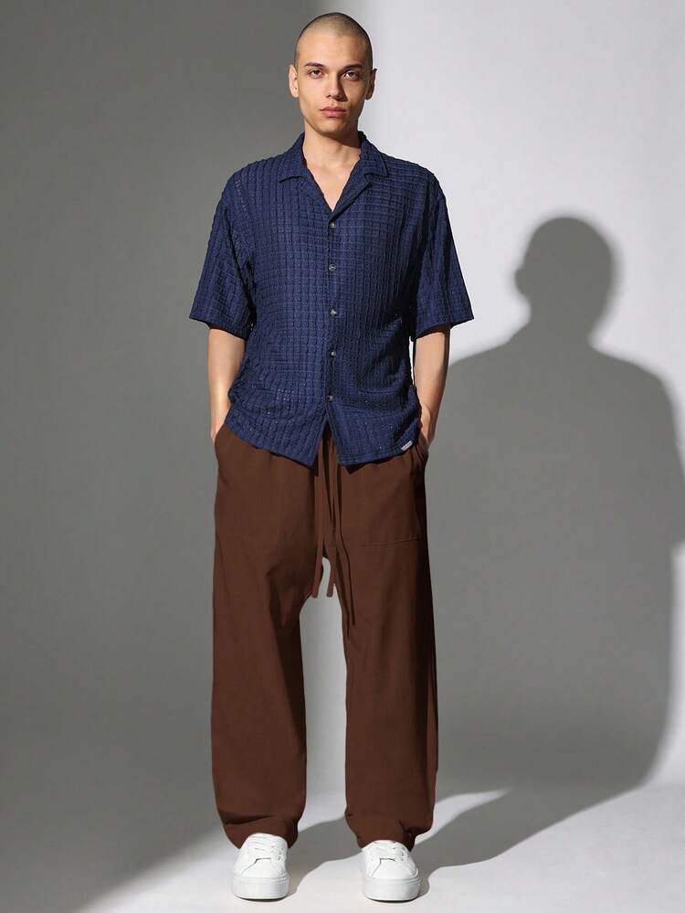 Pantalon large avec cordon de serrage et poches avant