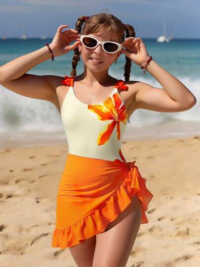 SHEIN Conjunto de traje de baño de una pieza con estampado floral y falda naranja anudada para niñas preadolescentes, estilo elevado para vacaciones de verano y playa