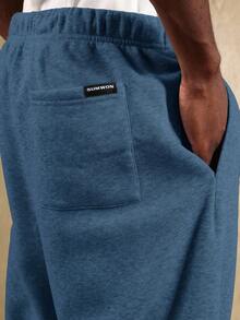 SUMWON 男士运动裤，黑色宽松版型 | 街头风 | INS 必备 | 休闲舒适 | 假日必备单品，这款黑色宽松版型运动裤采用优质面料制成，舒适透气，可轻松搭配任何运动或休闲服饰。简约设计使其成为各种场合的理想之选。 - 水鴨藍 - 查看 8