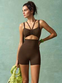 VARSITIE Conjunto deportivo de mujer de unicolor con diseño calado, tipo camiseta y pantalón corto