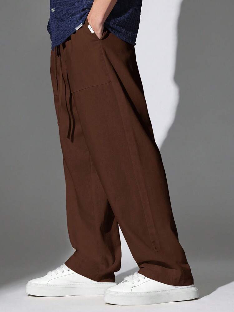 Pantalon large avec cordon de serrage et poches avant