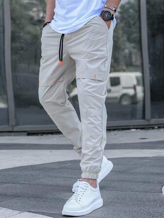 Pantalones casuales para hombres con bolsillos en diagonal y cordón en la cintura, otoño