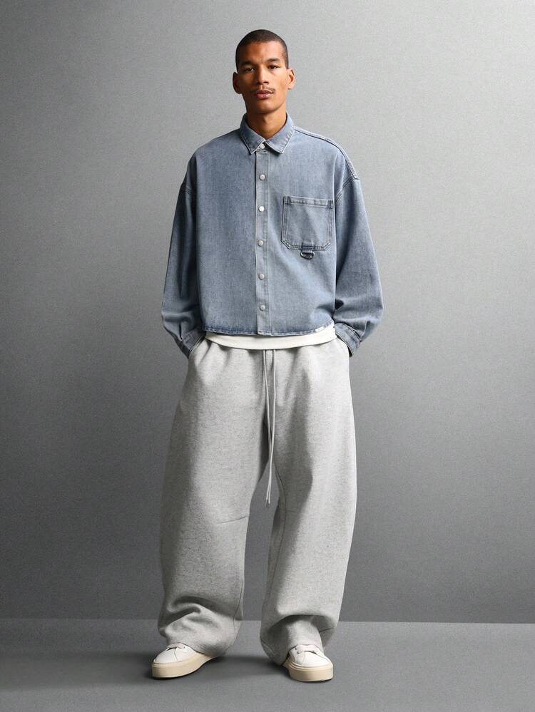 Light Wash Denim Button Down Shirt With Curved Hem