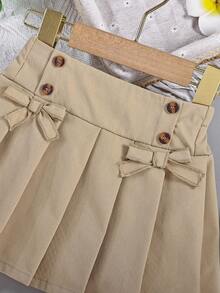 SHEIN 1pc Baby Girl Pleated Skirt, Children Woven Comfortable Skirt With Bow Waistband And Button Design, Adding Fashionable And Sweet Style, Elastic Waist And Loose Fit, Suitable For Autumn Occasions Like Vacation And Daily Wear - Khaki - View 4