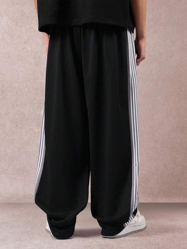 Wide Leg Track Pants With Side Stripes And Logo Patch