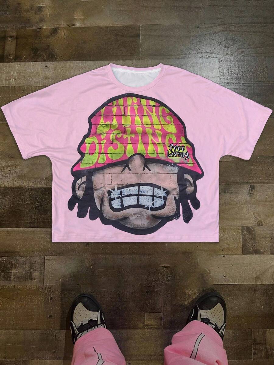 Manfinity Roghcode Camiseta de cuello redondo truncado para hombres, con patrón de cabeza de dibujo animado sobredimensionado, top holgado de estilo callejero - Rosa - Ver 1
