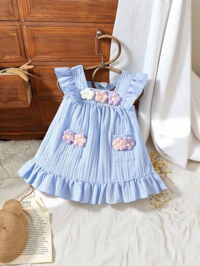 嬰兒女孩荷葉邊休閒裙，配有花朵裝飾貼袋