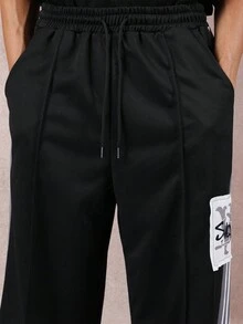 SUMWON Wide Leg Track Pants With Striped Side Panel Logo Patch Drawstring Waist Relaxed Fit Casual Streetwear Festival Winter Autumn - Black - View 2