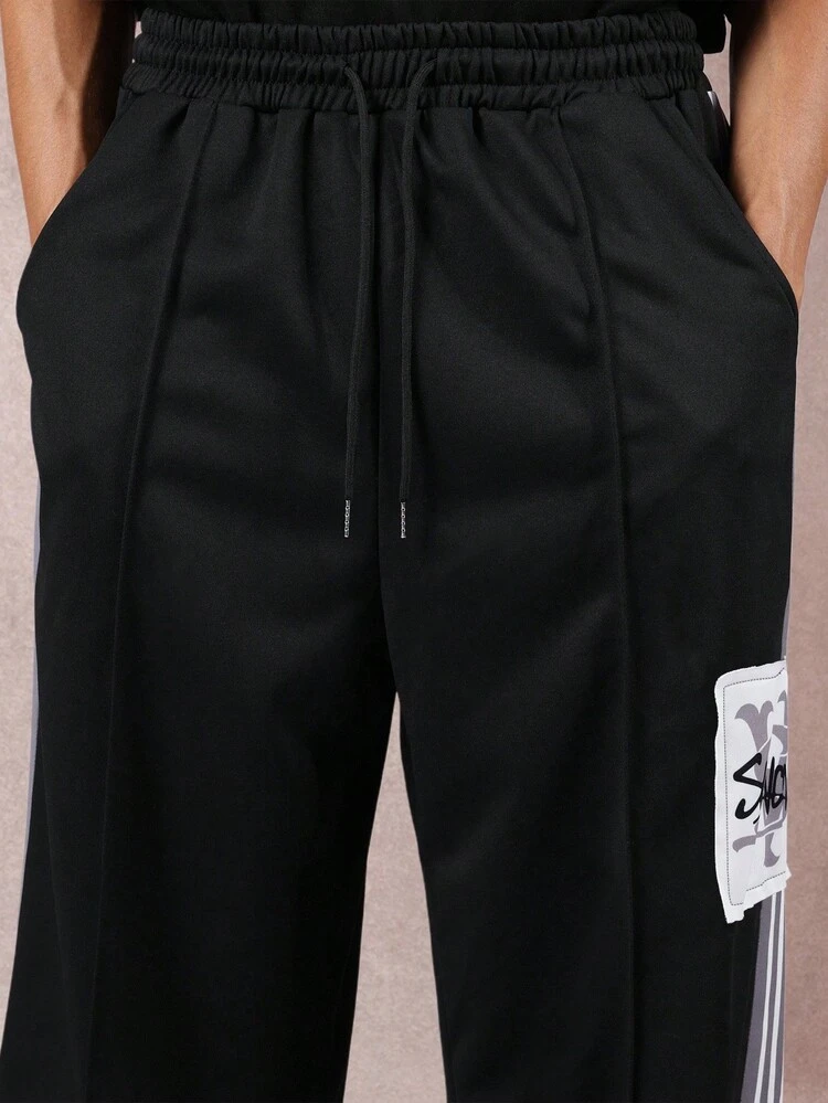 Wide Leg Track Pants With Side Stripes And Logo Patch