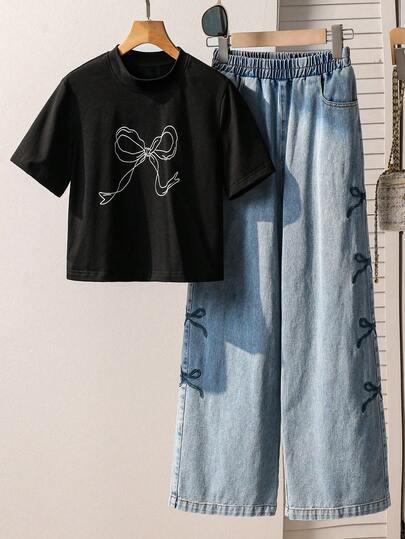 少女休闲时尚简约蝴蝶结印花圆领短款T恤，松紧腰设计，搭配宽松阔腿牛仔裤，饰有蝴蝶结，舒适百搭，适合日常穿着、通勤、外出、派对、拍照等场合。