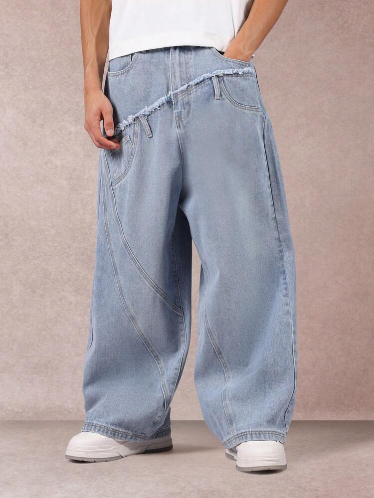 Asymetryczne jeansy z szerokimi nogawkami i postrzępioną talią