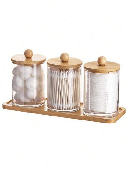 Juego de accesorios de baño con bandeja (4 PIEZAS) - Juego de 3 tarros de cristal acrílico para dispensar hisopos con tapas transparentes, 1 bandeja de tocador de bambú redonda para almohadillas y bastoncillos de maquillaje