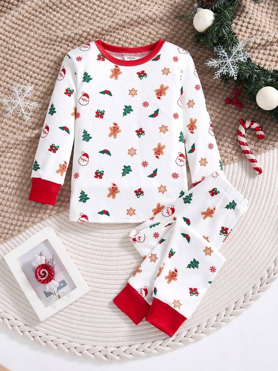 SHEIN Conjunto de pijama de 2 piezas con parte superior con gráfico navideño y pantalón pitillo para niños pequeños, con estampado de renos y copos de nieve, adecuado para Navidad - Rojo y blanco - Ver 1