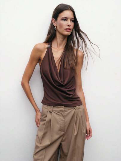 Nöista Brown Halter Top With Draped Cowl Neckline And Metal Ring Detail. Sexy Y2K Going-Out Top Perfect For Parties, Date Nights, Or Chic Summer Looks. Women's Sleeveless Crop-Style Halter Shirt.