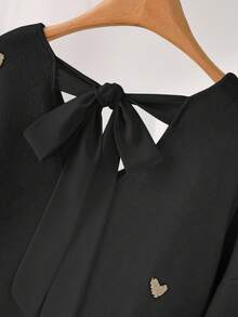 CosyJoli Suéter holgado con escote en V y espalda descubierta con estampado de corazones en beige para tallas grandes