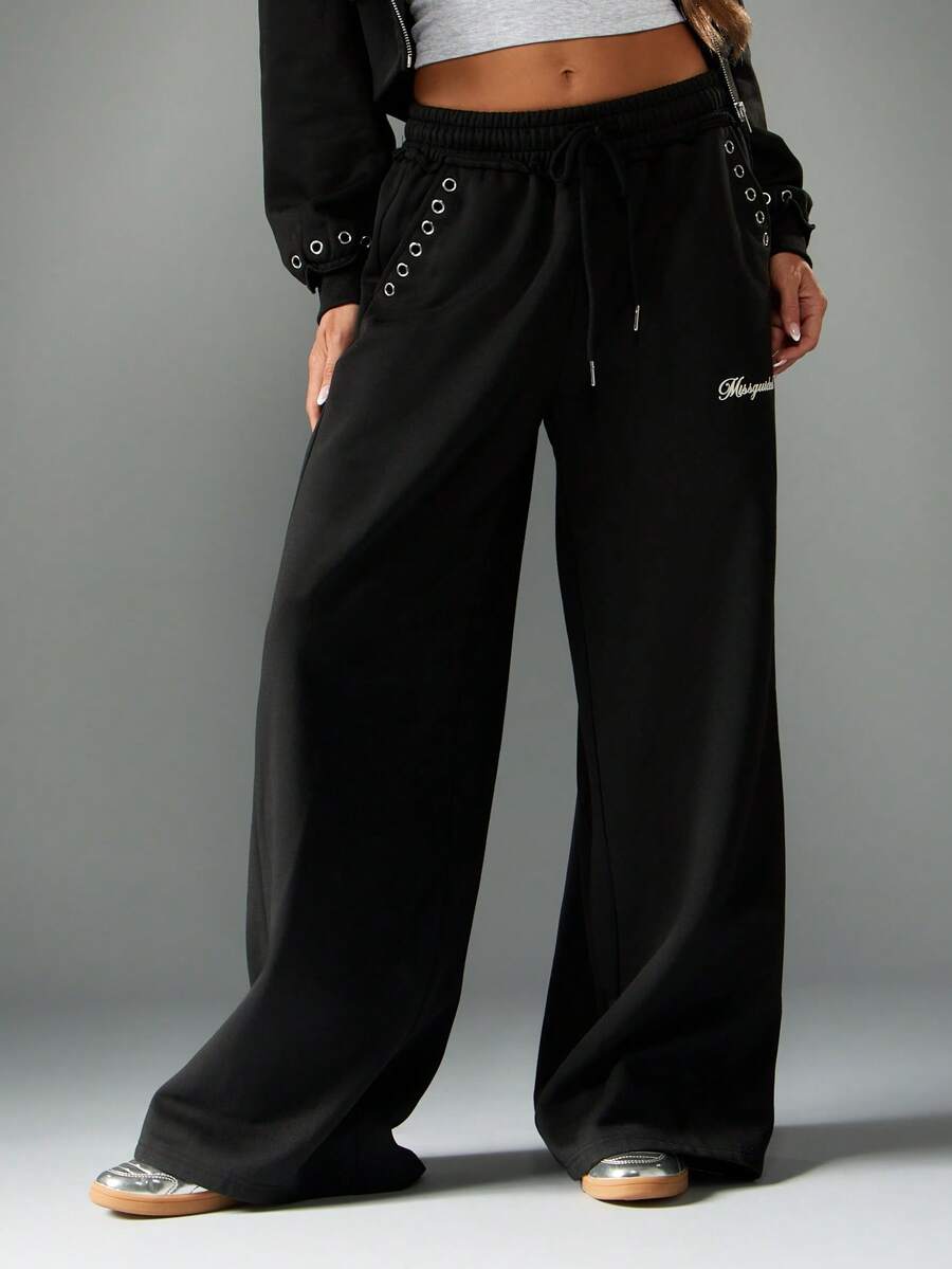 MISSGUIDED Quần thể thao ống rộng có chi tiết lỗ xỏ dây, cạp chun rút, thích hợp mặc ở nhà và dạo phố - màu đen - Xem 1