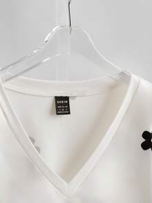 GlowEve Pull décontracté à col rond, manches raglan, tricot côtelé, patchwork, motif floral ajouré et clous à la mode pour femmes en automne - Noir et Blanc - Voir 5