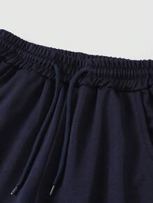 SHEIN Explorewe Calça de moletom casual para meninas (meninas pré-adolescentes), estampa minimalista de logotipo, bolso com decoração em cores contrastantes, calça de moletom de malha, calça comprida larga e relaxada