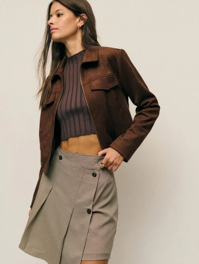 Nöista High-Waisted Beige Plaid Mini Skirt With An Asymmetric Wrap-Effect Front And Decorative Button Detailing, Offering A Modern And Structured Silhouette Perfect For Polished Winter Outfits, Elegant Everyday Looks, Christmas Gatherings And Refined New Year Styling.