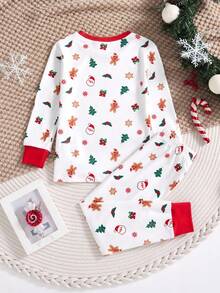 SHEIN Conjunto de pijama de 2 piezas con parte superior con gráfico navideño y pantalón pitillo para niños pequeños, con estampado de renos y copos de nieve, adecuado para Navidad - Rojo y blanco - Ver 2