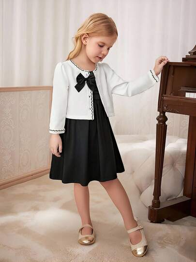 女孩优雅时尚优雅圆领插肩袖短款蝴蝶结装饰黑白夹克搭配纯色无袖高腰短裙套装，返校装，适合所有季节