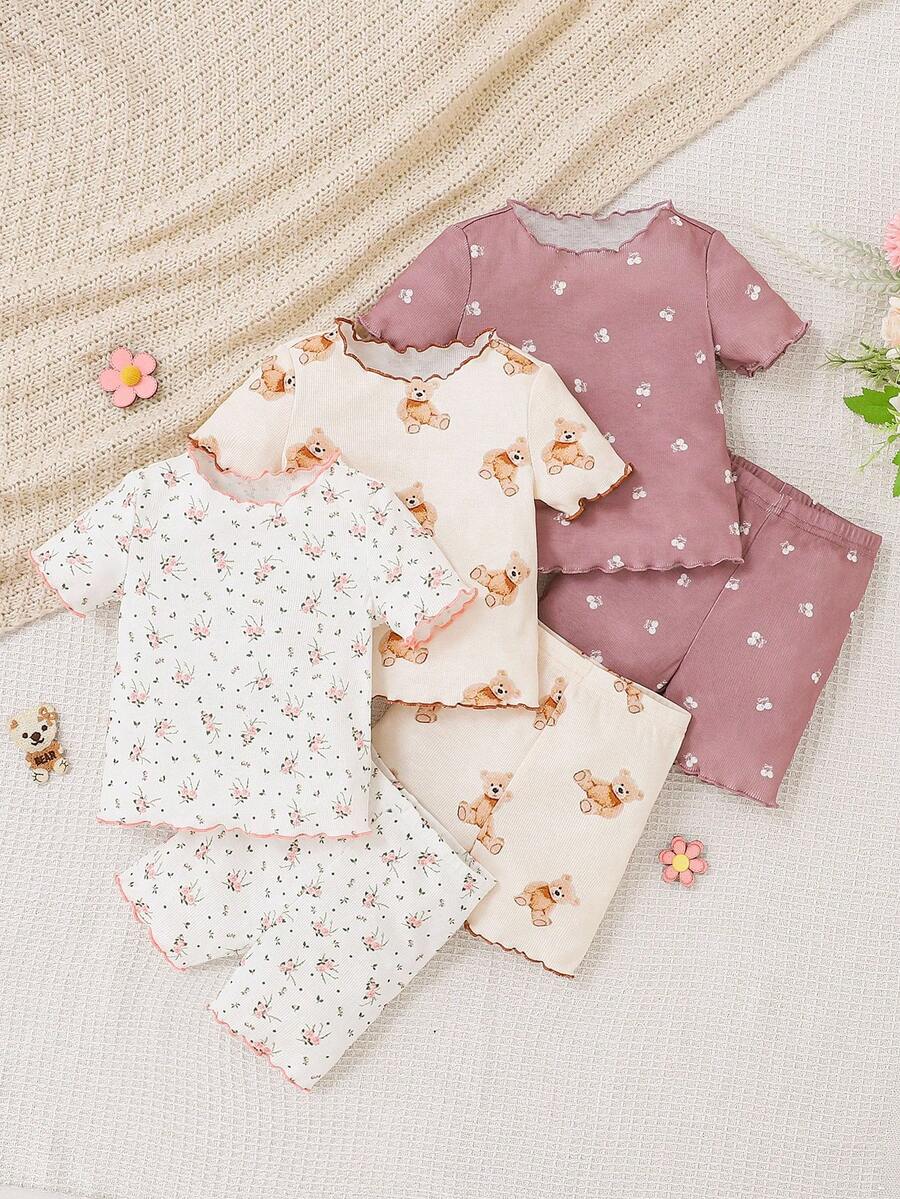 SHEIN 6 piezas Conjunto de pijama de verano para bebé niña con estampado de fresa, cuello redondo, manga corta, pantalón corto, de punto, suave y transpirable. Conjunto de pijama para bebé recién nacido. 4 piezas Conjunto de pijama casual para bebé niña con estampado sólido y de colores neutros, ropa de bebé unisex. - Multicolor - Ver 1