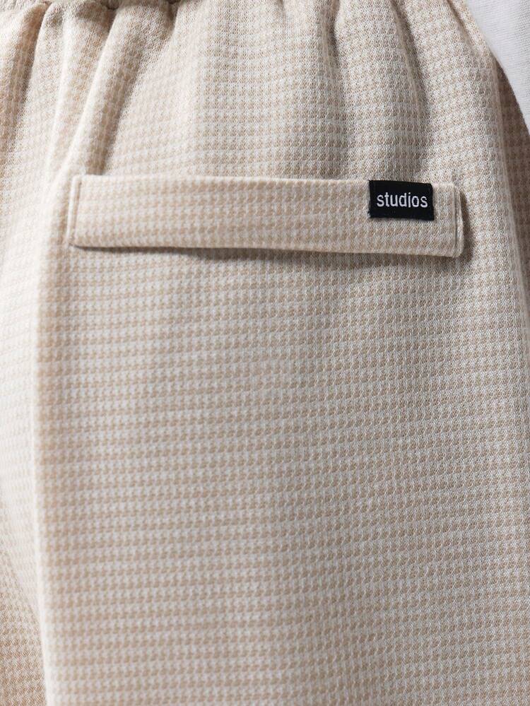 Pantaloni larghi con trama pied de poule