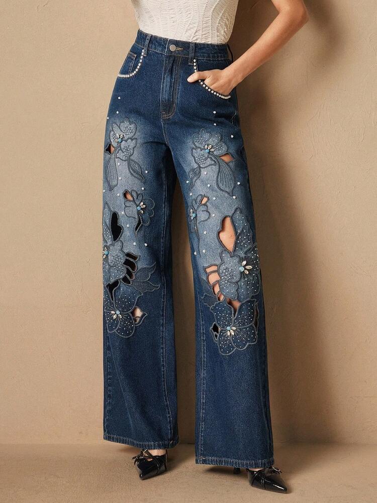 Pantalones de mujer de mezclilla azul casual y con bordados huecos de moda