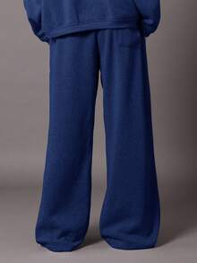 Quần thể thao ống rộng SUMWON, kiểu dáng thoải mái, chất liệu nỉ, có dây rút ở eo và túi bên hông, thích hợp cho mùa thu đông. - Màu xanh lam - Xem 5