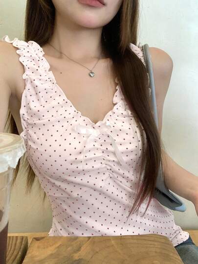 DAZY เสื้อเบลาส์แขนกุดผ้าลายจุดสไตล์เกาหลีของผู้หญิง ประดับโบว์อย่างหรูหรา